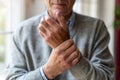 Senior man with arthritis rubbing hands Royalty Free Stock Photo