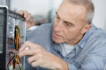 senior man assembling desktop computer Royalty Free Stock Photo