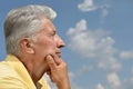 Senior man on background of sky Royalty Free Stock Photo