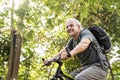 Senior man biking in the park Royalty Free Stock Photo