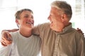 Senior man, boy and laugh with smile, happy and embrace with love, grandchild and joy. Grandparent, support or bonding