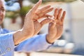 Senior man breaking cigarette at park Royalty Free Stock Photo