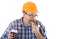 A senior man builder has a lunch with coffee and cake Royalty Free Stock Photo