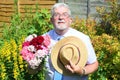 Senior man with bunch of flowers.