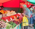Senior man buying vegetables in Vegetable Fair