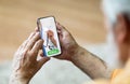 Senior Man Calling Doctor On Smartphone While Sitting At Home Royalty Free Stock Photo