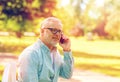 Senior man calling on smartphone at summer park Royalty Free Stock Photo