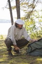 Senior man camping Royalty Free Stock Photo