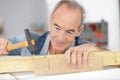 Senior man carpenter working with hammer Royalty Free Stock Photo