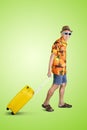Senior man carrying a luggage in the studio Royalty Free Stock Photo