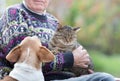 Senior man with cat and dog Royalty Free Stock Photo