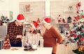 Senior man celebrating christmas with happy niece giving her gift box Royalty Free Stock Photo
