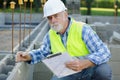 senior man checking cement blocks Royalty Free Stock Photo