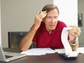 Senior man checking home finances Royalty Free Stock Photo