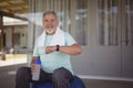 Senior man checking time on wristwatch after work out Royalty Free Stock Photo