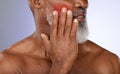 Senior man with cheek pain in studio with tooth ache, illness or dental problem in his mouth. Sick, painful and elderly Royalty Free Stock Photo