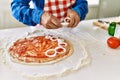 Senior man cooking pizza at kitchen Royalty Free Stock Photo