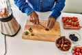 Senior man cutting datil at kitchen Royalty Free Stock Photo