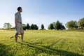 Senior man cutting grass with shears Royalty Free Stock Photo