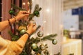 Senior woman decorating a Christmas tree at home. Royalty Free Stock Photo