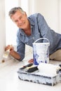 Senior man decorating house Royalty Free Stock Photo
