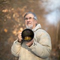 Senior man devoting time to his favorite hobby - photography