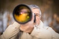 Senior man devoting time to his favorite hobby - photography