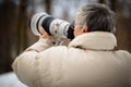 Senior man devoting time to his favorite hobby - photography