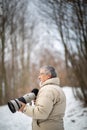 Senior man devoting time to his favorite hobby - photography