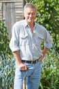 Senior Man Digging Vegetable Patch On Allotment Royalty Free Stock Photo