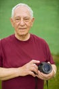 Senior man with digital camera Royalty Free Stock Photo