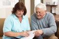 Senior Man In Discussion With Health Visitor Royalty Free Stock Photo