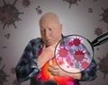 Senior man with diseased lungs surrounded by viruses on background Royalty Free Stock Photo