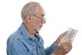 Senior man doing crossword