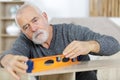 senior man doing diy works Royalty Free Stock Photo
