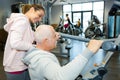 senior man doing sport exercises with personal trainer Royalty Free Stock Photo