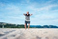 Senior man doing stretching exercises on the beach Royalty Free Stock Photo