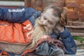 Senior man with dreadlocks beard and face paint sleeping