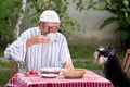 Senior man drinking coffee in garden Royalty Free Stock Photo