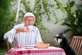 Senior man drinking coffee in garden Royalty Free Stock Photo