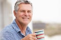 Senior man drinking coffee outdoors Royalty Free Stock Photo