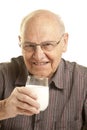Senior man drinking a glass of milk Royalty Free Stock Photo