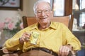 Senior man drinking hot beverage Royalty Free Stock Photo