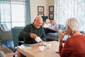 Senior man drinking hot tea with his wife at retirement community Royalty Free Stock Photo