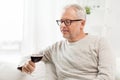 Senior man drinking red wine from glass at home Royalty Free Stock Photo