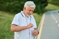 Senior man drinking water while morning scamper. Royalty Free Stock Photo