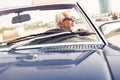 Senior Man Driving A Convertible Classic Car Royalty Free Stock Photo