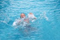 Senior man drowning in swimming pool