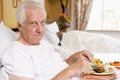 Senior Man Eating Hospital Food In Bed Royalty Free Stock Photo