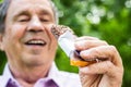 Senior man eating a protein bar Royalty Free Stock Photo